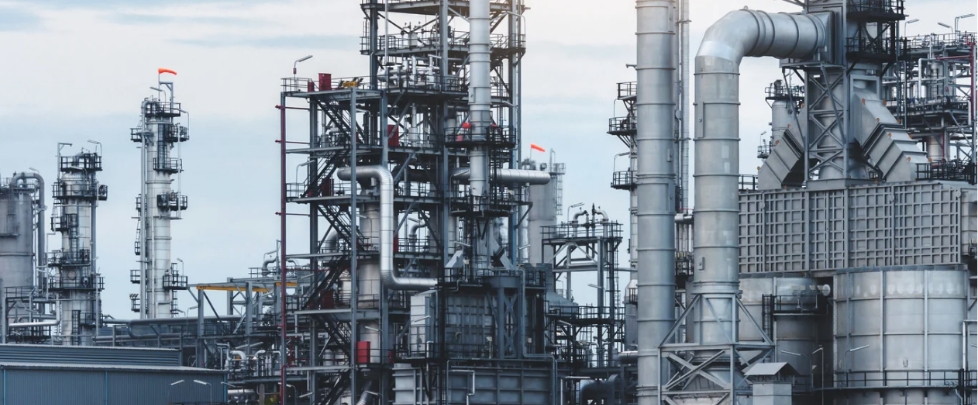 Oil and gas industrial facility supported by wastewater treatment and water management systems for reliable operations in remote and energy-intensive environments.