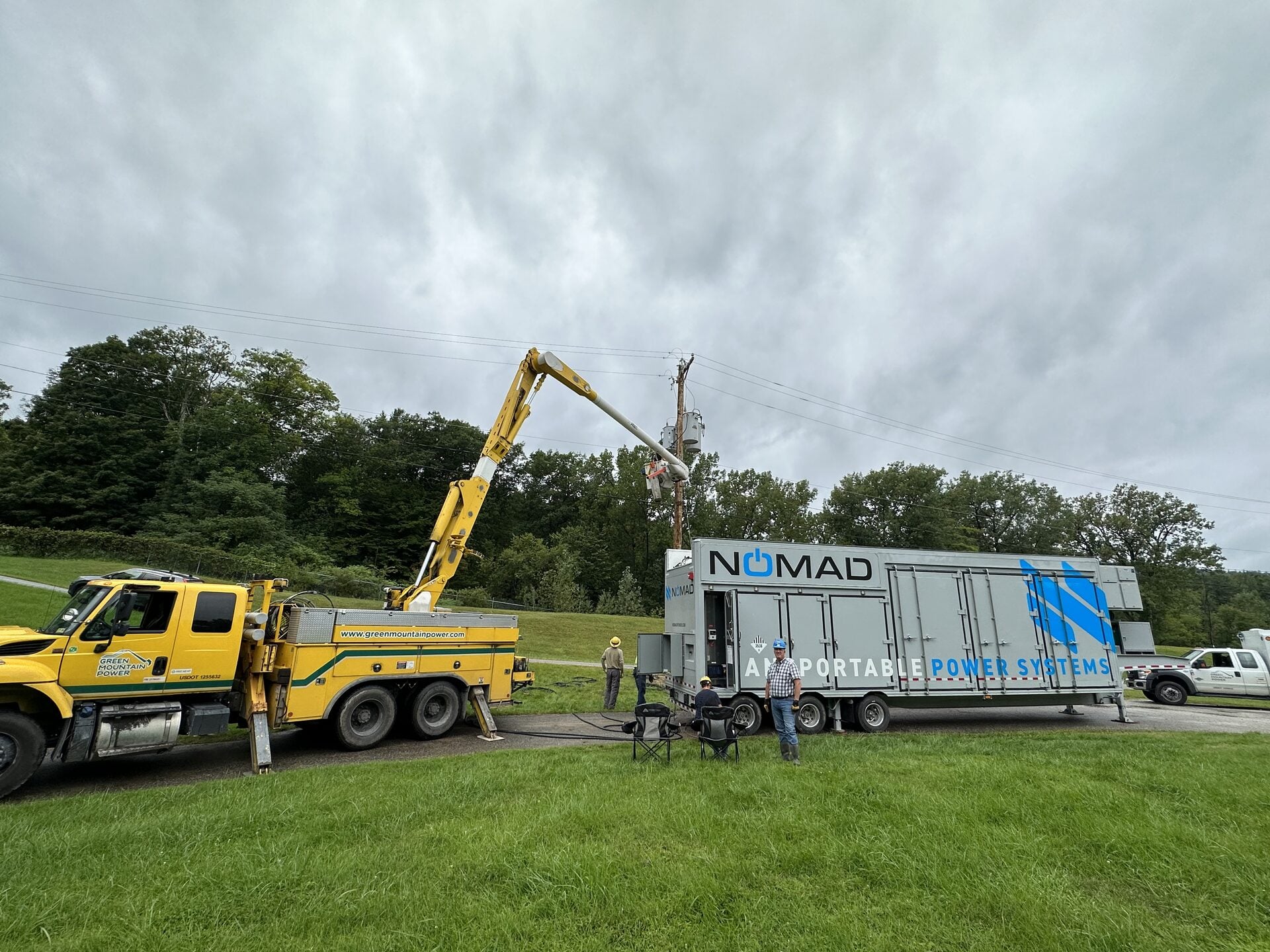 Utility crew connecting a mobile battery energy storage unit during planned maintenance.