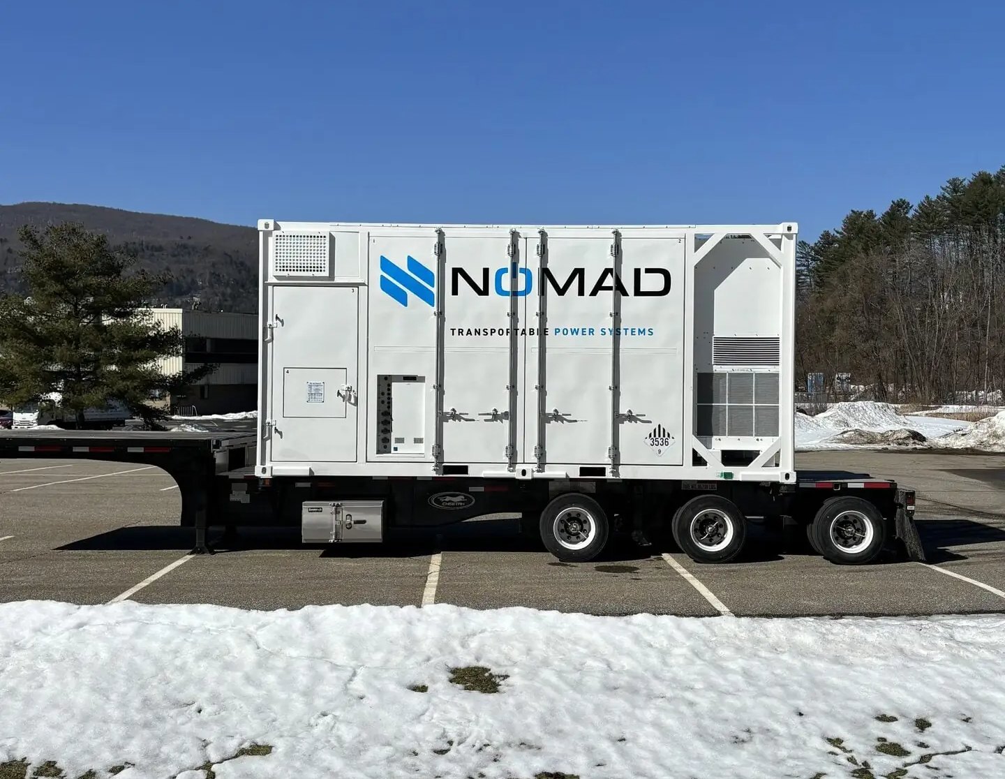 NOMAD Voyager Eagle mobile battery energy storage unit on a trailer in winter conditions.